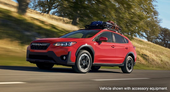 The 2021 Subaru Crosstrek driving on a road.