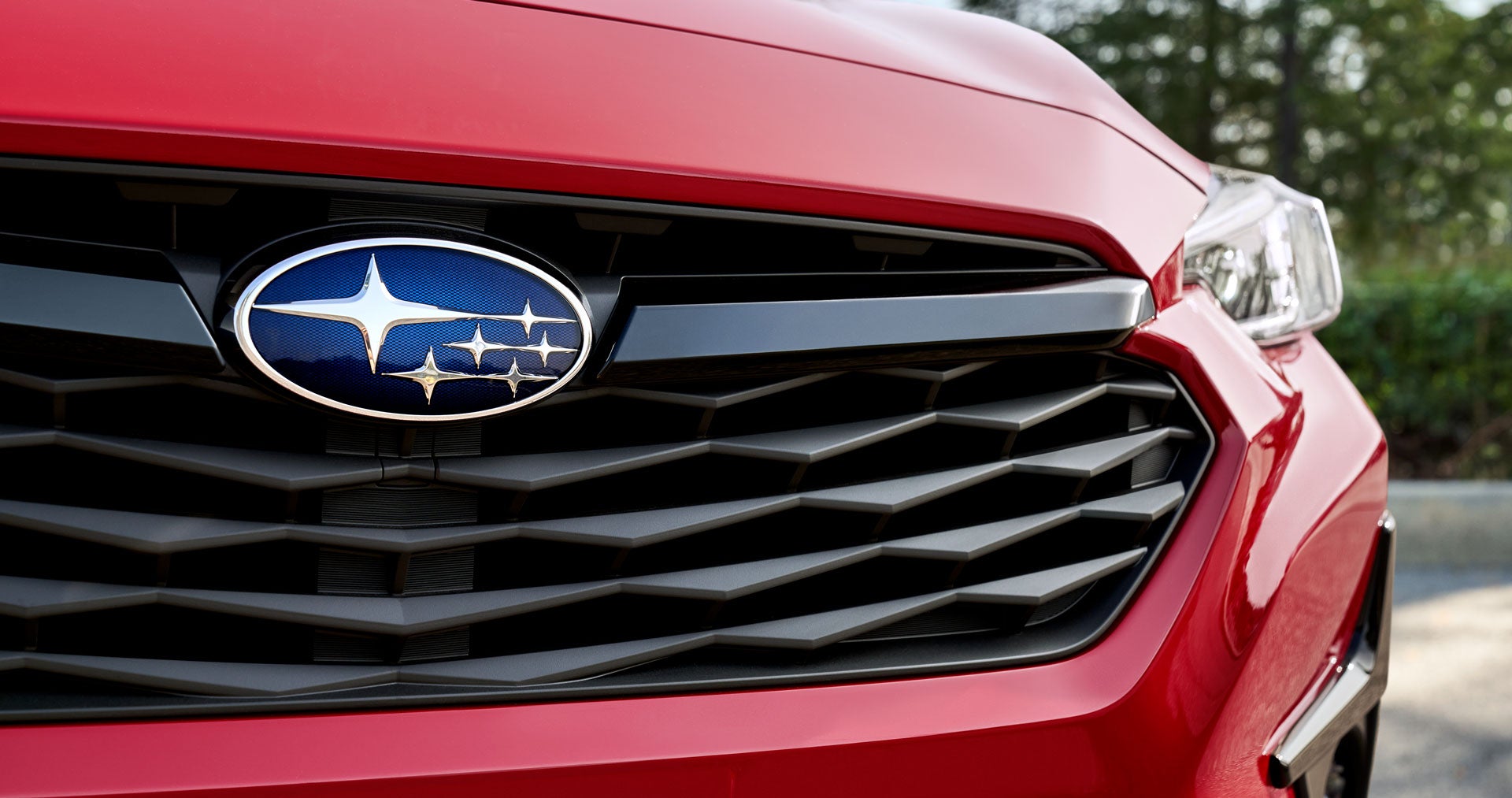 Close-up of 2024 Subaru front grille logo badge